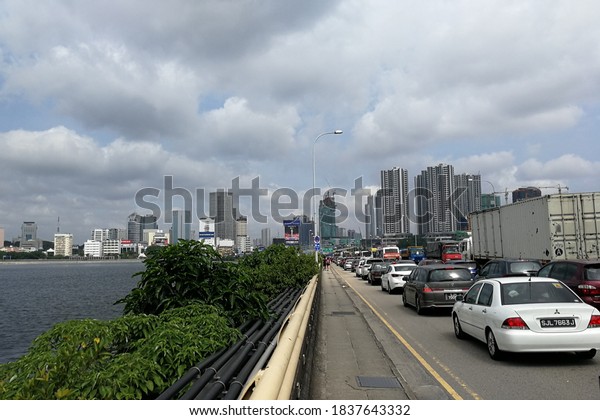 Singapore - Dec 20 2017: Crossing the border\
causeway from Singapore to Johor. Traffic congestion on the highway\
connecting both\
cities