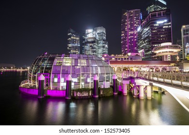 SINGAPORE - DEC 28: Buildings around Marina Bay at night taken in Singapore on December 28, 2012  - Shutterstock ID 152573405
