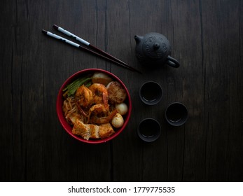 Singapore Dry Laksa Flatlay. Singapore Laksa Top Down Shot On Wooden Table With Copy Space. Dark Food Photography.