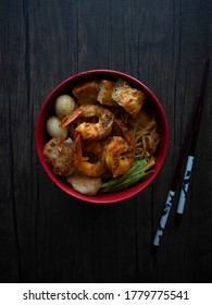 Singapore Dry Laksa Flatlay. Singapore Laksa Top Down Shot On Wooden Table With Copy Space. Dark Food Photography.