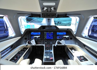 SINGAPORE - FEBRUARY 12: Cockpit Of An Embraer Phenom 300 Business Jet At Singapore Airshow February 12, 2014 In Singapore