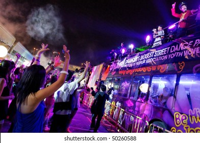 SINGAPORE - FEBRUARY 20: Party Revelers Dancing At City Alive! 2010, Singapore's Largest Dancing Street Party February 20, 2010 In Singapore