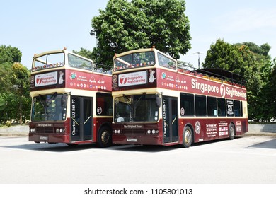 Singapore - February 2018: Two Open Top Double Decker Tourist Bus.