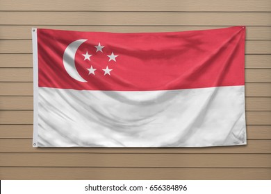 Singapore Flag Hanging On A Wall