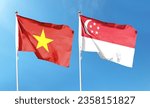 Singapore flag and Vietnam flag on cloudy sky. fluttering in the sky