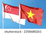 Singapore flag and Vietnam flag on cloudy sky. fluttering in the sky