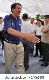 SINGAPORE - JANUARY 10: Defense Minister Teo Chee Hean Extending Hand For Handshake During Singapore 2010 Youth Olympic Games Official Logo Launch Ceremony January 10, 2009 In Singapore