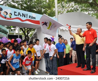 SINGAPORE - JANUARY 10: Minister Vivian Balakrishnan Flagging Off A Run At The Launch Of The Singapore 2010 Youth Olympic Games Logo January 10, 2009 In Singapore