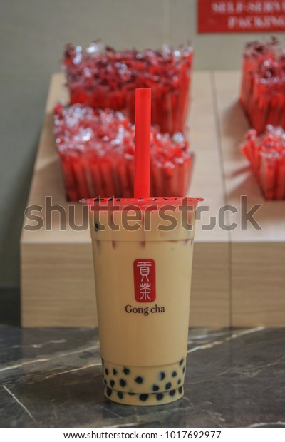 Singapore, Singapore - January 29, 2018: Pearl Milk Tea with Red Bubble Straw by Gong Cha