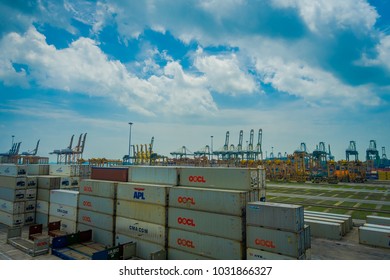 SINGAPORE, SINGAPORE - JANUARY 30, 2018: Outdoor view of a container at the Port with somes cranes at background in Singapore. Ship-to-shore STS gantry cranes at shipping yard