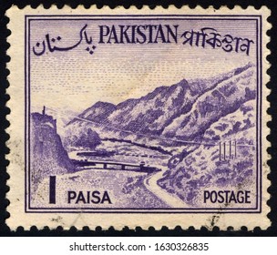 SINGAPORE – JANUARY 30, 2020: A stamp printed in Pakistan shows image of The Khyber Pass - a mountain pass connecting the town of Landi Kotal and Pakistan border, circa 1961