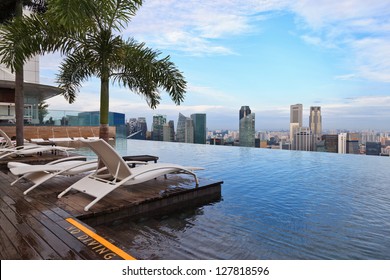 SINGAPORE - JANUARY 5: Infinity swimming pool of the Marina Bay Sands on January 5 , 2013 in Singapore. It is 150m long and set on world's largest cantilevered platform.