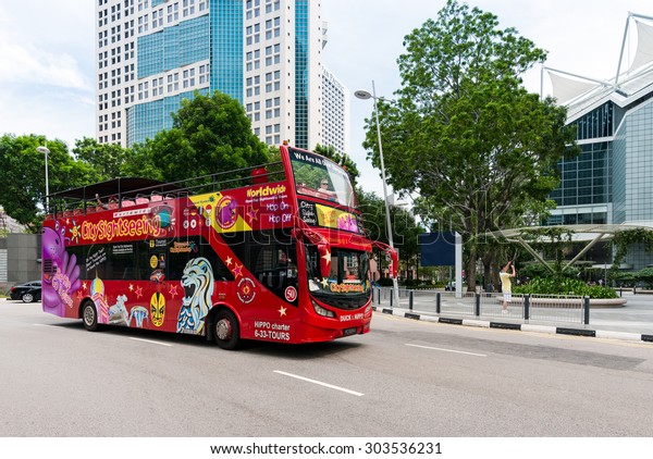 SINGAPORE - JULY 09:\
Sightseeing bus Hop on-Hop off on July 09, 2015 in Singapore.\
Singapore is a world famous tourist city with highly developed\
economic\
infrastructure.