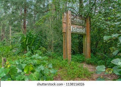 Singapore - july 15, 2018: Sign in the Jungle. Coney Island, alternatively known as Pulau Serangoon, is a 133-hectare island located off the northeastern coast of Singapore.