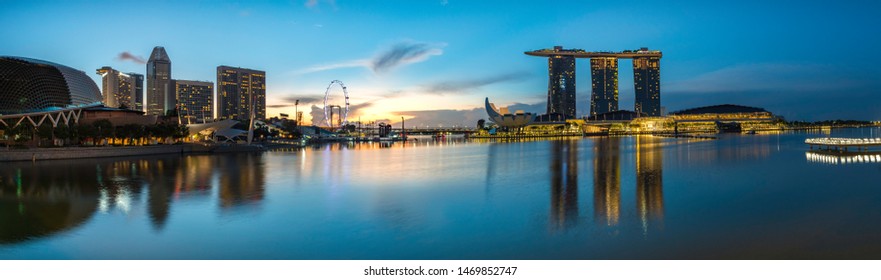Singapore - July 2, 2017: Panorama view from Anderson Bridge showing famous landmarks of Singapore: Esplanade-Theatres on the Bay; Singapore Flyer and Marina Bay Sands
