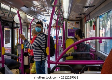 SINGAPORE - JULY 27, 2022 : Passenger Wearing Mask Protect Covid-19 While Inside The City Bus Singapore. Public Transport In The City Singapore.