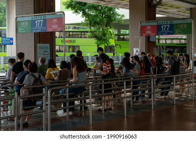 SINGAPORE, SINGAPORE - Jun 04, 2021: Crowd Of People Waiting For Bus At Butik Botok Interchange, Singapore