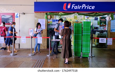 Singapore Jun21 2020 Customers In Queue Line Scanning Entry Code Prior To Entry To NTUC Fairprice Supermarket, Via Safe Entry Digital Contact Tracing App. Circuit Breaker Coronavirus Outbreak; Phase 2