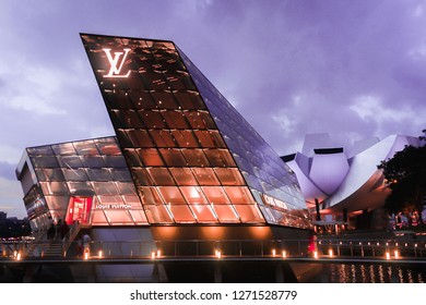 SINGAPORE, SINGAPORE - JUNE 23 2018: The Crystal Pavilion, Louis Vuitton glass building with the ArtScience Museum in the background.