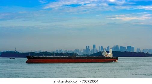 SINGAPORE, MALAYSIA - May 03, 2017: Crude Oil Tanker FRONT ENERGY (IMO: 9292228, Marshall Islands) Sailing Along Straits Of Singapore In Ballast. A 317 Mt Long, 60 Mt Width Vessel Has A 305,318 DWT