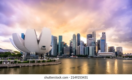 Singapore - Mar 8, 2022 : Beautiful sunset at Marina bay with Artscience Museum as the main focus.