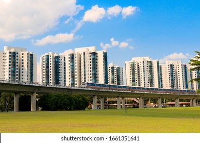 Singapore, March 2, 2020
Residents Building With MRT Track.
Blue Sky Background