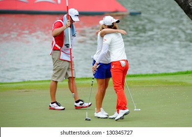 SINGAPORE - MARCH 3: American Stacy Lewis Hugging Na Yeon Choi As She Won The HSBC Women's Champions At Sentosa Golf Club Serapong Course March 3, 2013 In Singapore