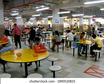 Singapore, March 8, 2016: People Eating At A Typical Singapore Food Court Or Hawker