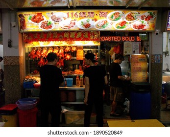 Singapore, March 8, 2016: Restaurant Waiters In A Typical Singapore Food Court Or Hawker