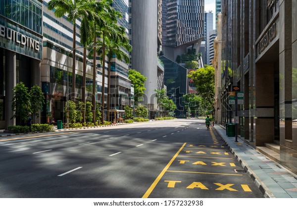 Singapore - May 2020: Quiet Singapore street\
with less tourists and cars during the city lockdown\
called\