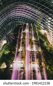 SINGAPORE, SINGAPORE - MAY 26, 2021: The Falls Inside Flower Dome Greenhouse At Night Time In Singapore