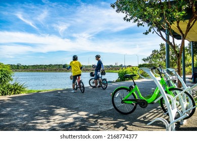 Singapore - May 29, 2022 : Cyclists At Rower’s Bay Park. It Features A Boardwalk That Brings Visitors Closer To The Water, A Lookout Pavilion, Swales And A Wetland.