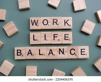 Singapore - May 8 2022: The Word WORK LIFE BALANCE Spelt Out With Wooden Scrabble Letter Tiles