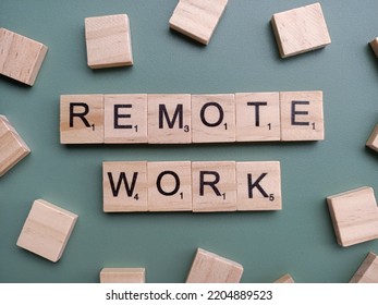 Singapore - May 8 2022: The Word REMOTE WORK Spelt Out With Wooden Scrabble Letter Tiles