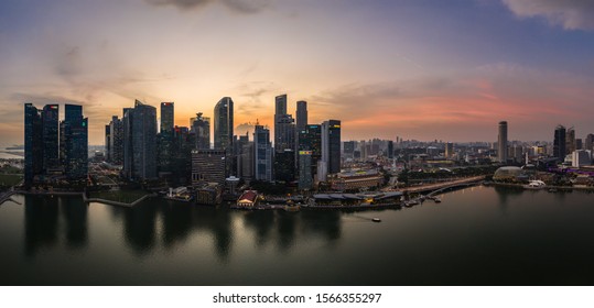 Singapore - November 3 2019: The sun sets over the famous Singapore skyline by the Marina Bay in Southeast Asia main financial center