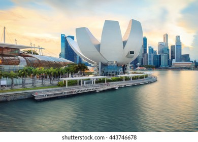 Singapore, Republic of Singapore - May 7, 2016: Panorama of Marina Bay with Artscience lotus flower museum at sunset.