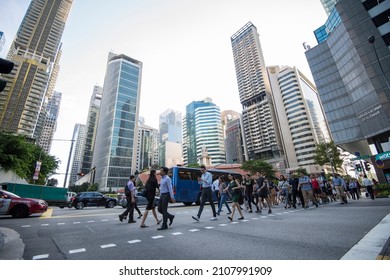 Singapore, Singapore - September 08, 2019: At The End Of The Working Day
Office Workers Walking On The Streets Of The Central Business District.