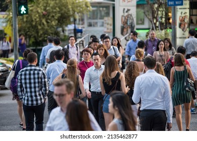 Singapore, Singapore - September 08, 2019: At The End Of The Working Day
Office Workers Walking On The Streets Of The Central Business District.