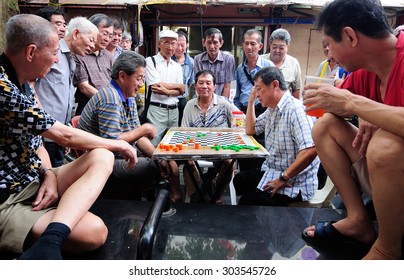 Singapore, September 2012. Unidentified Local People Played Chinese Chess In Chinatown Street Market.