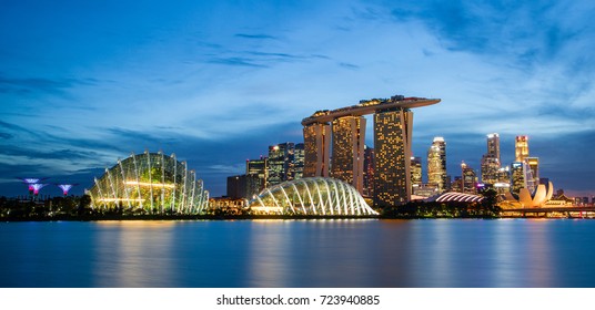 SINGAPORE - SEPTEMBER 8, 2017: Singapore skyline at Marina Bay during sunset blue hour showing Marina Bay Sands resort and Gardens by the Bay. Opened in 2010, it is one of the most recognizable icons.