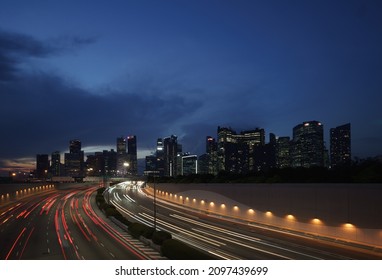 Singapore Skyline and Business District (Shenton way) and Marina coastal expressway (MCE) at rush hour