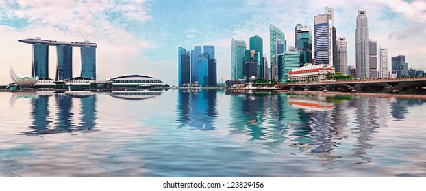 Singapore Skyline - Modern Skyscrapers With Reflection In Water. Day Cityscape Panorama