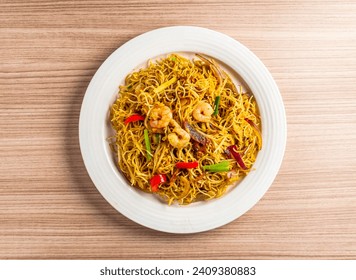 singapore style fried rice noodles served in dish isolated on table top view of hong kong food