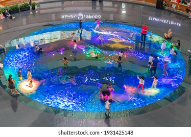 SINGAPORE-JANUARY 27,2020 :Children Run Around In The Digital Light Canvas In Singapore. The Digital Light Canvas Display Is An Interactive Art Installation At Shoppes At Marina Bay Sands