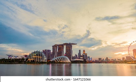 SINGAPORE-MAY 19, 2019 : Cityscape Singapore modern and financial city in Asia. Marina bay landmark of Singapore. Landscape of business building and hotel. Panorama view of Marina bay with sunset sky.