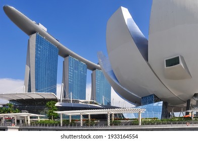 Singapore-May 2020: Low angle view of the iconic Marina Bay Sands hotel with three towers topped by a connecting SkyPark including infinity pool and ArtScience Museum