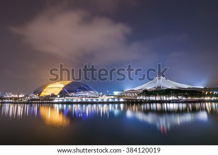 Singapore's new National Stadium illuminated at night in after rain weather