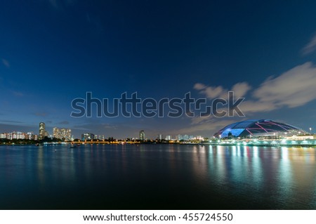 Singapore's new National Stadium illuminated at evening