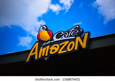 Singburi / Thailand - November 3, 2019: Brand logo of one of the most popular coffee shop in Thailand, Cafe Amazon, at Petroleum Authority of Thailand or PTT petrol station with blue sky background