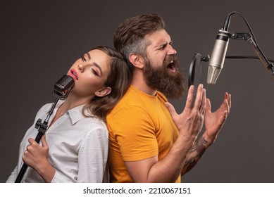 Singer Couple Singing Rock. Sound Producer Recording Song In A Music Studio. Excited Duet Karaoke.